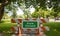 Closed park text sign, street barriers and traffic cones on green trees background. 3d illustration