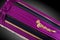 Closed purple coffin covered with elegant cloth on gray background. coffin close-up with gold flowers.