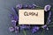 Closed sign for alternative therapy business - word burnt in wood with purple lavender flowers and amethyst clusters