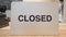 Closed Sign at the Cashier in Shopping Mall Clothing Store. 4K zoom motion