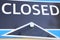 Closed sign - shown in navy blue and white colours