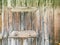 Closed small window frame on weathered wooden barn wall. closeup view