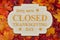 Closed Thanksgiving Day sign with fall leaves