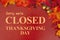 Closed Thanksgiving Day sign with fall leaves