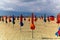 Closed umbrellas in the beach on a gloomy day