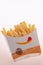 Closed up of Burger King\'s french fries on white background. Focus on Burger King\'s logo