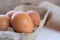 Closed up chicken eggs on paper box. Food background. High nutrition ingredient for meal