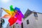 Closed up of colorful rainbow pinwheel in sun shine summer day.