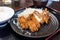 Closed up deep fried pork cutlet coated with flaky panko bread c