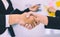Closed up hand shaking in business deal