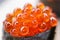 Closed up Ikura Salmon Roe Sushi from Sushi Set on the Stone Plate.
