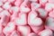 Closed Up a Pair of Pastel Pink and White Heart Shaped Marshmallow on the Pile of Same Candies