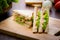 Closed up Tuna sanwich on wooden cutting board