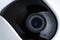 Closed up view of Internet IP video camera with small wide angle lens with white plastic cover using in security monitoring or