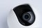 Closed up view of Internet IP video camera with small wide angle lens with white plastic cover using in security monitoring or