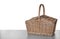 Closed wicker picnic basket on white background