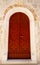 Closed wooden door on the bell tower of the Benedictine monastery of Saint Margarita in the town of Pag, on the Croatian island of