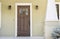 Closed wooden door of a home