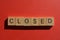 Closed, word in 3d wood alphabet letters