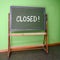 Closed written on an old school chalkboard to symbolize the closure of schools as preventive measure during the risk of infection