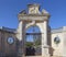 The Closed wrought Iron and Black painted Garden Gates and entrance to the Gardens of the Estoi Palace.