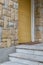 Closed yellow vertical roller door and stone bricks colored wall