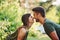 Closeness of people. Beautiful young couple have a good time in the forest at daytime