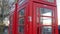 Closer look of the red telephone booth in London