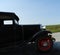 Closeup of 1931 antique car driving by on country road