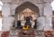 Closeup of 3 nandi statues behind fire at Virupaksha temple, Hampi, Karnataka, India