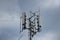 Closeup of a 4g 5g communications mobile tower on top of a hill, antennas for broadcasting signals