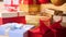 Closeup 4k footage of lots of colorful boxes with gifts and presents decorated with ribbons and bows. Perfect shot for