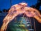 Closeup abstract image of colorful illuminated water stream in fountain at park