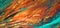 Closeup of abstract oil painting of orange and aquamarine on canvas, background of colors, blurs, fire