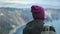 Closeup active travel woman in hat admiring seascape nature from mountain peak enjoying vacation