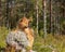 Closeup of the adorable fluffy brown Finnish Spitz in the boreal forest