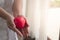 Closeup of Adult woman hands holding red heart. Health, Medicine, Insurance and Charity concept
