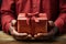 closeup African American man hands holding gift red cardboard box