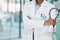 Closeup african american woman doctor standing with a stethoscope in the hospital. I need to listen to your heart beat