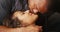 Closeup of African boyfriend kissing his girlfriend