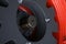 Closeup of an agricultural machinery tire with on an orange wheel