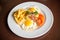 Closeup american breakfast with fried potato bacon eggs