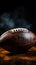 Closeup an American football ball shrouded in dramatic smoke