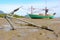 Closeup anchor with fishing boat on the coast