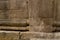 Closeup ancient Roman brick wall column cornice