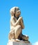 Closeup of Angel statue in cemetery, bright blue sky, Languedoc France