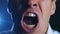 Closeup angry businessman screaming. Aggressive boss threatens violence. Stress at work.