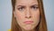 Closeup angry woman waving head on camera in studio. Sarcastic woman face