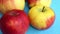 Closeup of apples on rotating blue plate