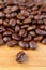 Closeup an Arabica Roasted Coffee Bean with Blurry Coffee Beans Pile in Background